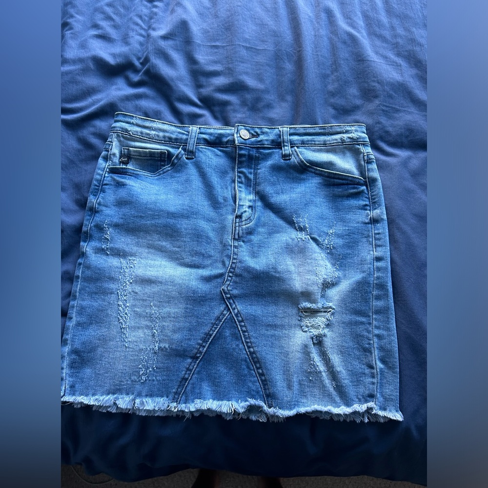 Distressed denim mini skirt